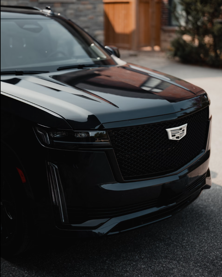 Detailed front view of a black Cadillac Escalade